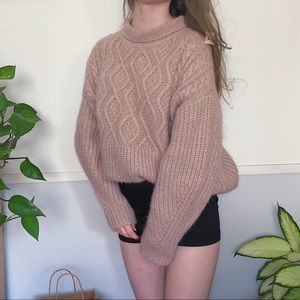 Soft knit pink sweater with cuffed neckline